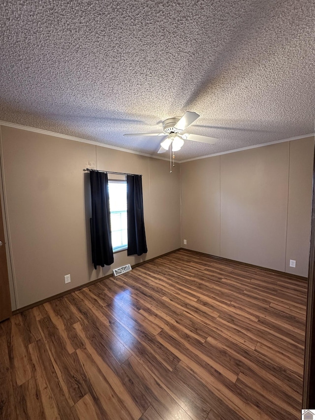 unfurnished room featuring ceiling fan, crown molding, a textured ceiling, and dark hardwood / wood-style flooring