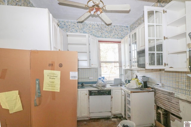 kitchen with sink, backsplash, white cabinets, and white dishwasher