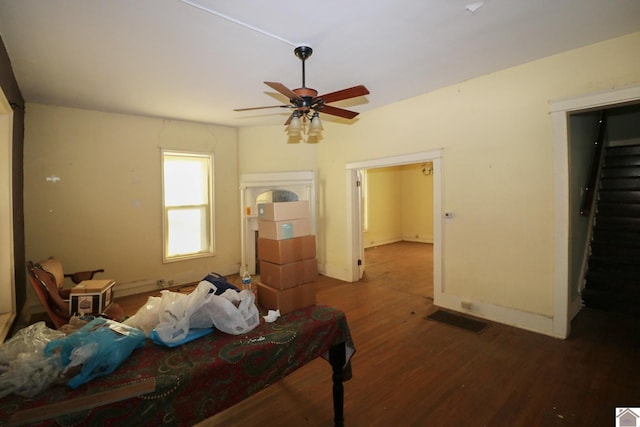 unfurnished bedroom featuring dark hardwood / wood-style flooring and ceiling fan