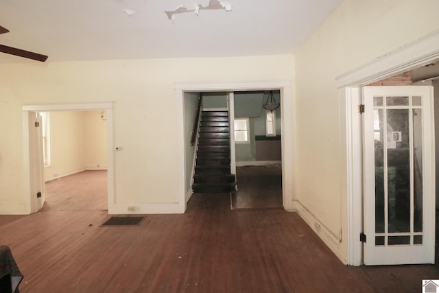 corridor featuring dark hardwood / wood-style flooring