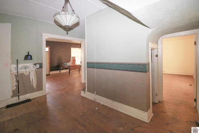 corridor with hardwood / wood-style floors