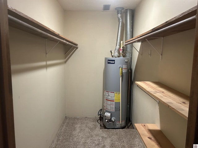 utility room with water heater