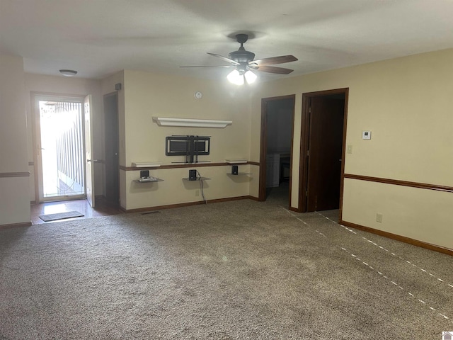 spare room with ceiling fan and carpet flooring