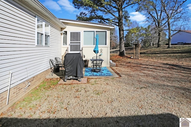 exterior space with a grill