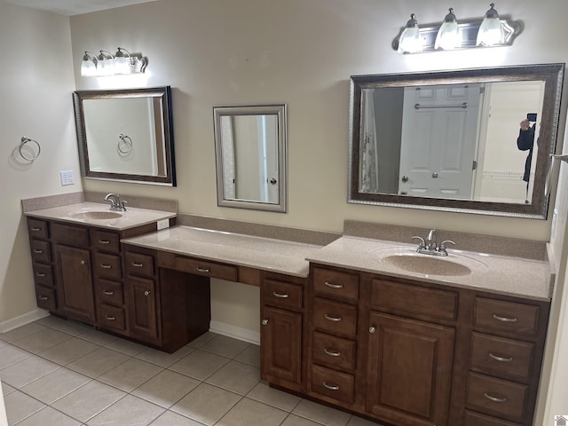 bathroom featuring tile patterned flooring and vanity