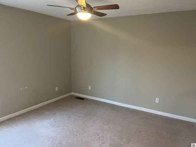 empty room featuring ceiling fan and carpet flooring