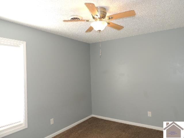 carpeted empty room with a textured ceiling and ceiling fan