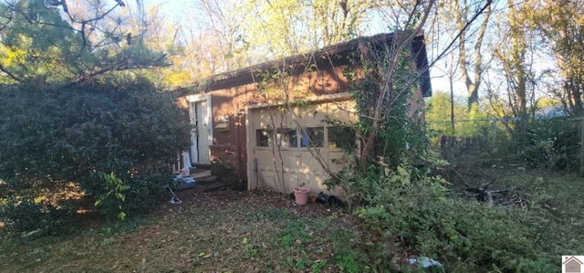 view of home's exterior featuring a garage and an outdoor structure