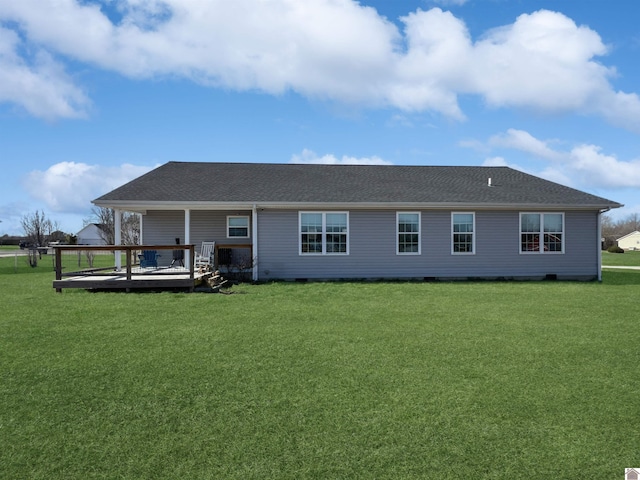 back of house with a wooden deck and a lawn