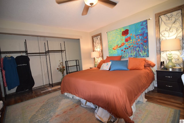 bedroom with dark wood-type flooring and ceiling fan