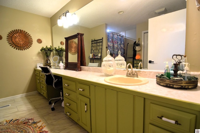 bathroom with vanity and curtained shower