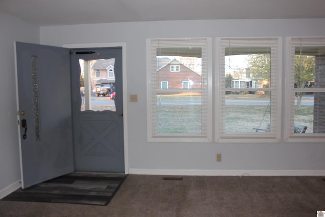 view of carpeted foyer