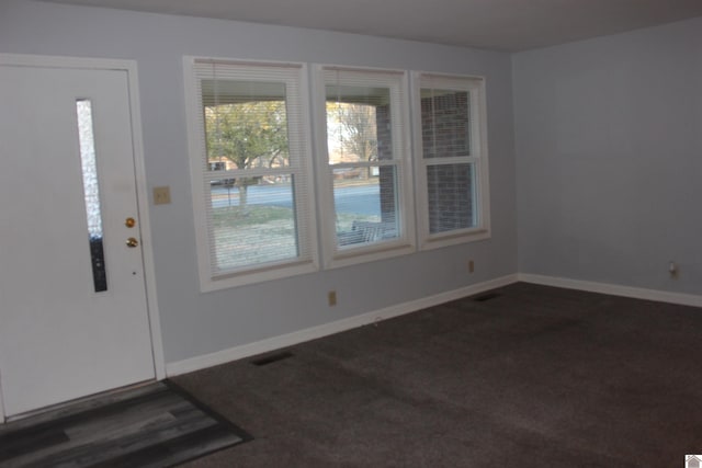 view of carpeted entrance foyer