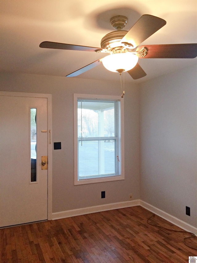 foyer with dark wood-type flooring and ceiling fan