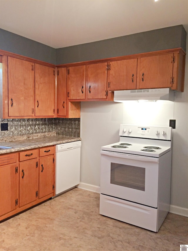 kitchen with tasteful backsplash and white appliances