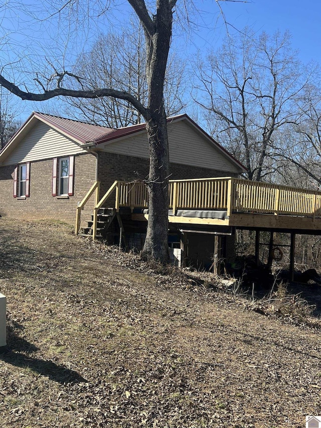 view of property exterior featuring a deck