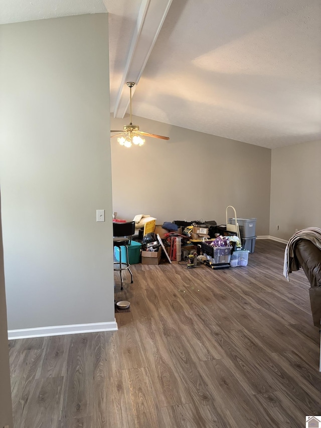 interior space with ceiling fan, wood-type flooring, and beam ceiling