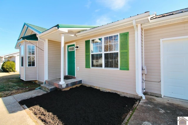 entrance to property featuring a garage