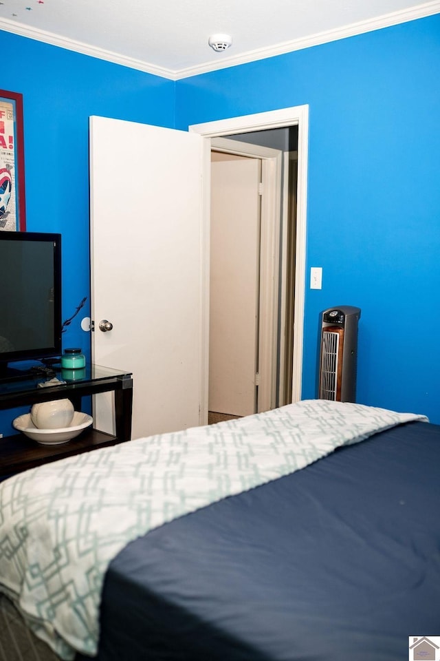 bedroom with ornamental molding