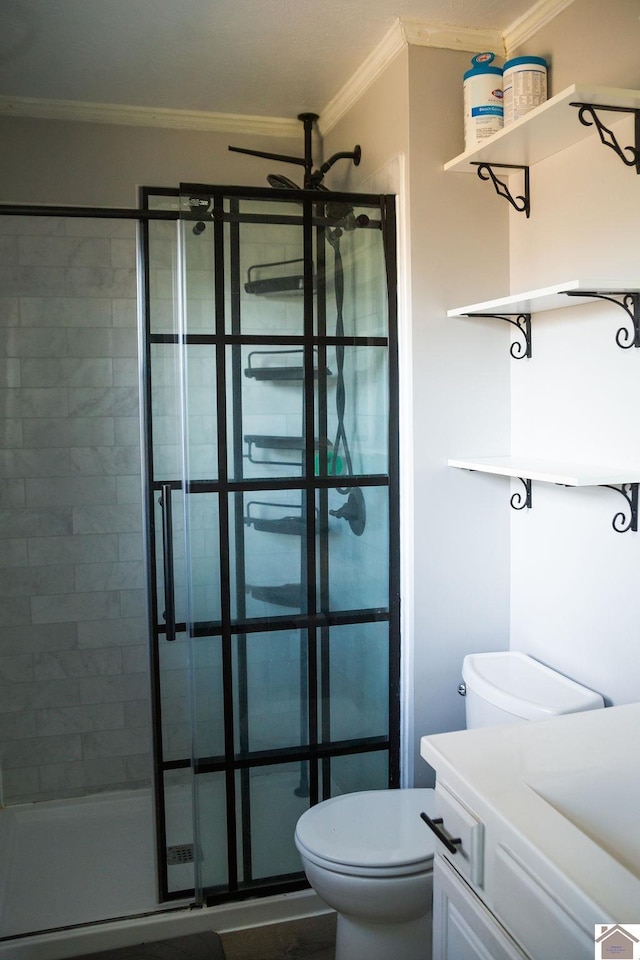 full bath featuring ornamental molding, a stall shower, vanity, and toilet