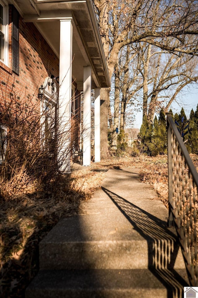 view of side of home featuring brick siding