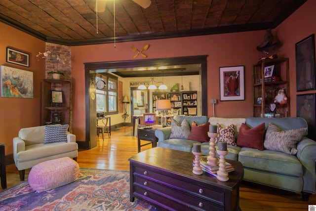 living room with crown molding, ceiling fan, and light hardwood / wood-style flooring