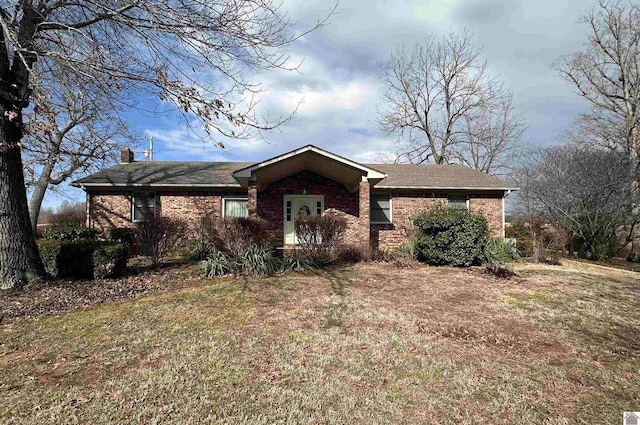 single story home featuring a front yard