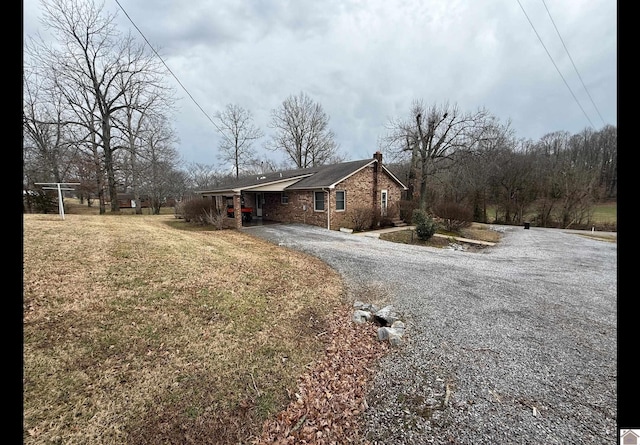 view of property exterior with a lawn