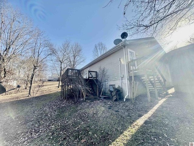 view of side of home with a deck