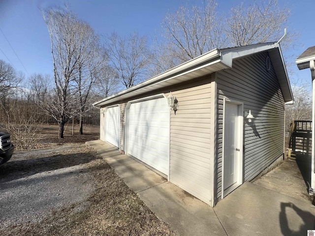 view of home's exterior featuring a garage and an outdoor structure