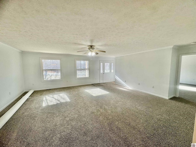 empty room featuring ceiling fan, crown molding, a textured ceiling, and carpet flooring