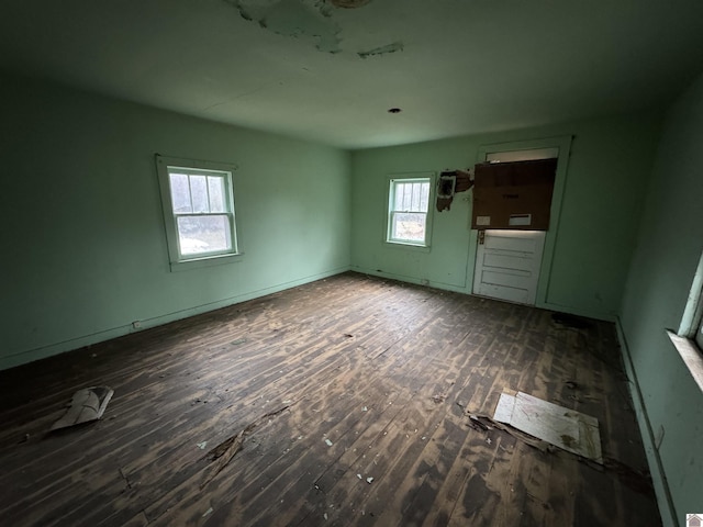 empty room featuring dark wood-type flooring