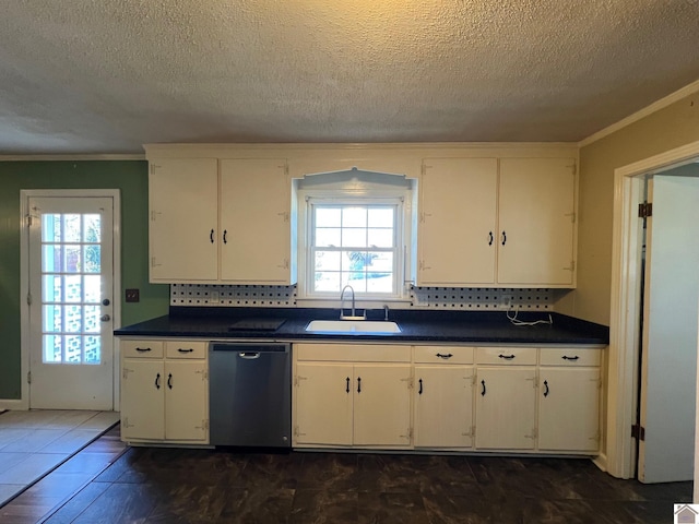 kitchen with dishwasher, sink, white cabinets, and backsplash