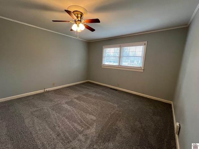 carpeted spare room featuring ornamental molding and ceiling fan