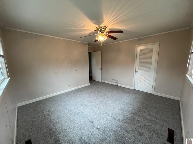 unfurnished bedroom with crown molding, carpet floors, and ceiling fan