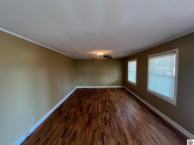 unfurnished room featuring ceiling fan, ornamental molding, dark hardwood / wood-style floors, and a textured ceiling