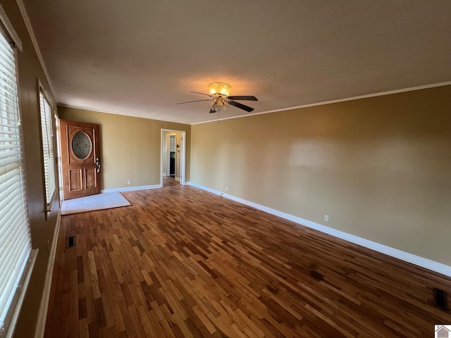 unfurnished living room with ceiling fan, ornamental molding, and hardwood / wood-style floors