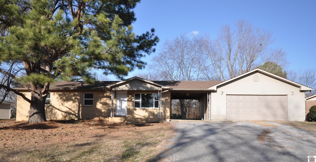 single story home with a garage