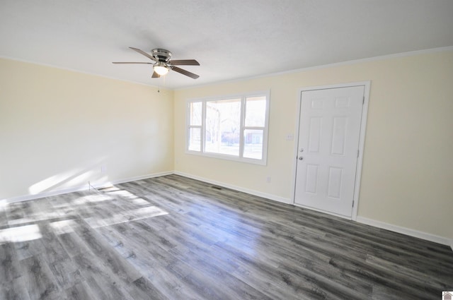 empty room featuring ornamental molding, dark hardwood / wood-style floors, and ceiling fan