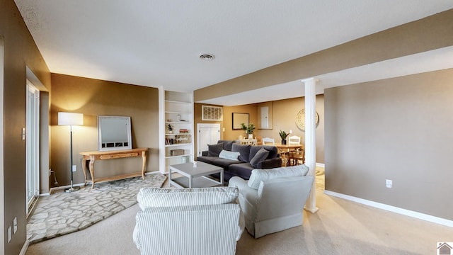 carpeted living room with built in shelves