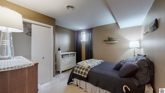 carpeted bedroom featuring lofted ceiling and a closet