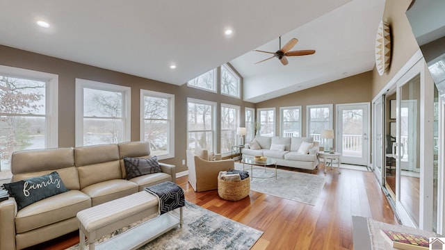 sunroom / solarium featuring lofted ceiling and ceiling fan