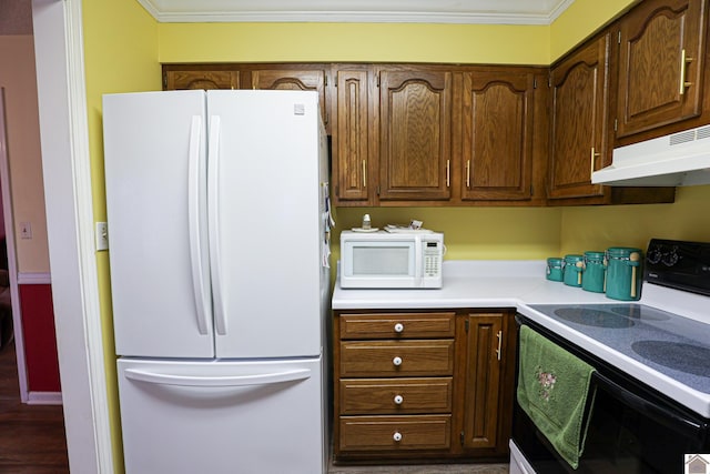 kitchen featuring white appliances and ornamental molding