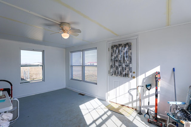 sunroom / solarium featuring ceiling fan