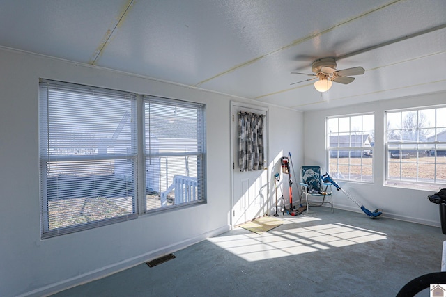 interior space featuring ceiling fan