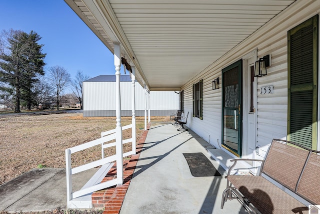 view of patio featuring a porch