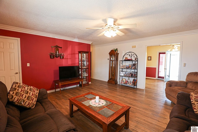 living room with crown molding, ceiling fan, a textured ceiling, and dark hardwood / wood-style flooring