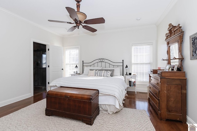 bedroom featuring crown molding, dark hardwood / wood-style floors, and ceiling fan