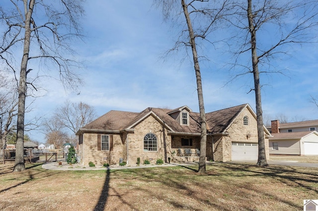 view of front of home with a garage and a front yard