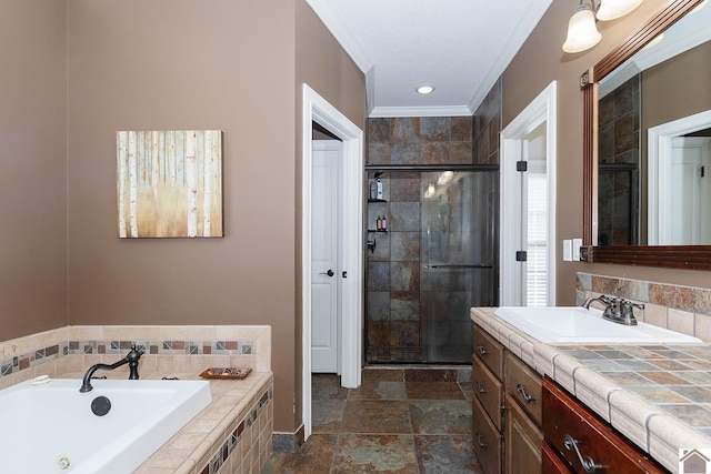 bathroom featuring plus walk in shower, ornamental molding, and vanity